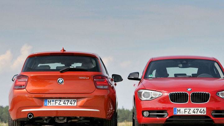 Front And Back Pose of 2012 BMW 1-Series in Orange And Red